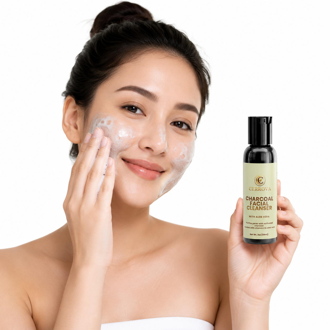 Woman applying Cerrova Charcoal Facial Cleanser while holding the bottle on a white background