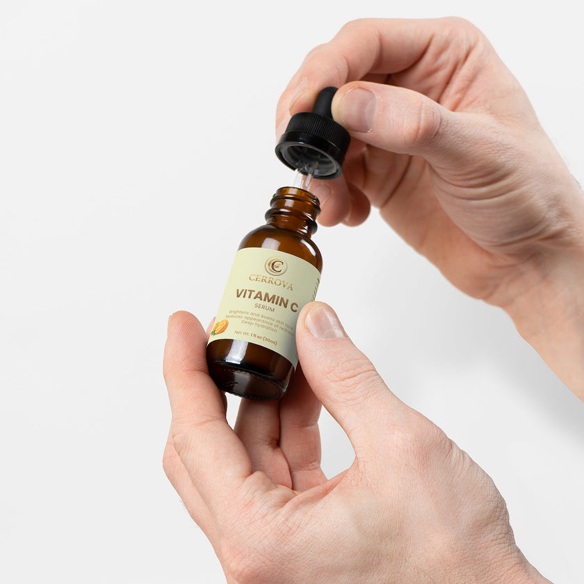 Hand applying Cerrova Vitamin C Serum as part of a skincare routine